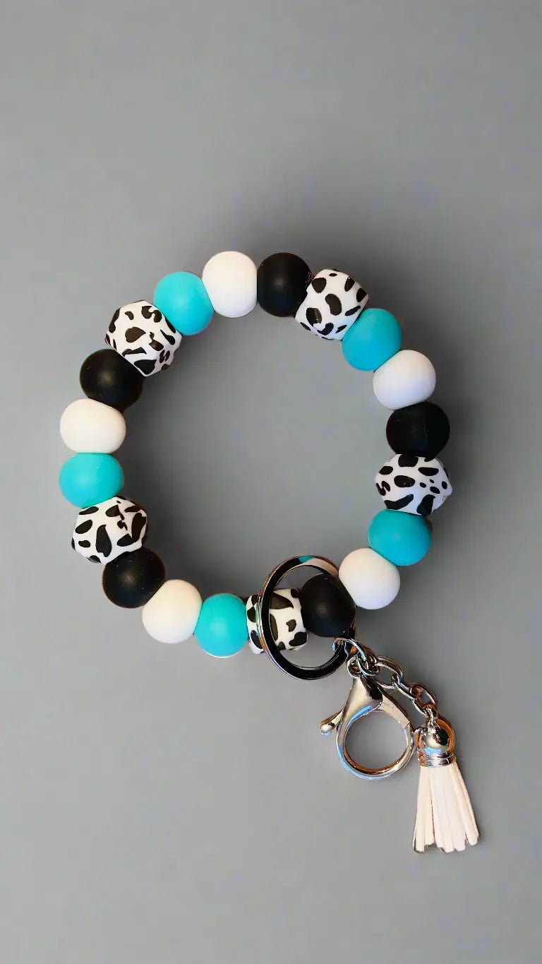 Wristlet Keychain Colors: Cow print, Turquoise, Black, and White K's Crafty Vibes Co.