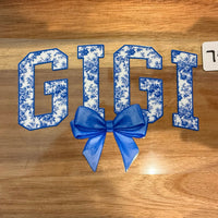 #748 GiGi with blue bow K's Krafty Barn