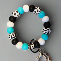 Wristlet Keychain Colors: Cow print, Turquoise, Black, and White K's Crafty Vibes Co.